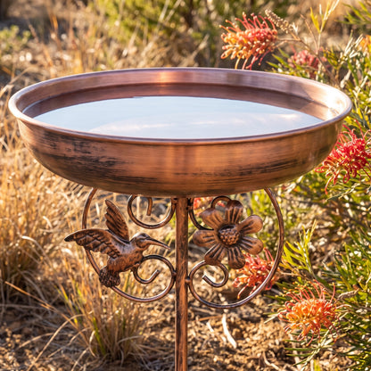 Ray's copper bird bath in a sunny Australian garden bed