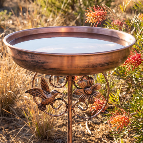Ray's copper bird bath in a sunny Australian garden bed