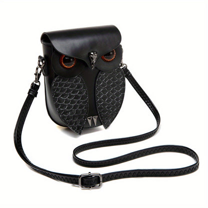 Owl bag shown with its adjustable braided crossbody strap laid out