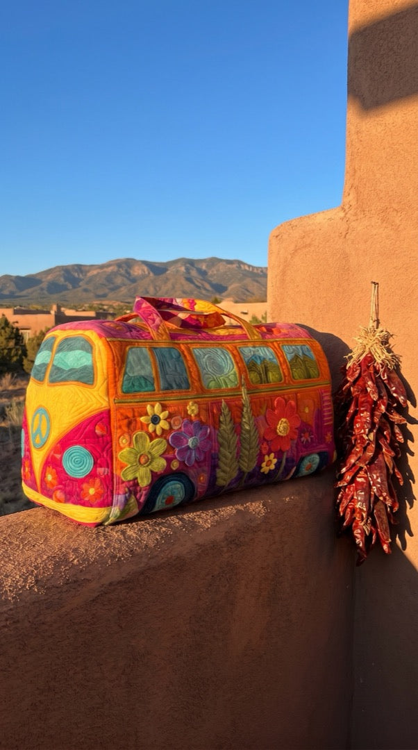 Hippie Bus Weekender against an adobe wall