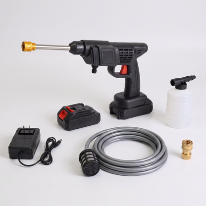 Complete kit laid out: washer, batteries, charger, foam bottle, suction hose