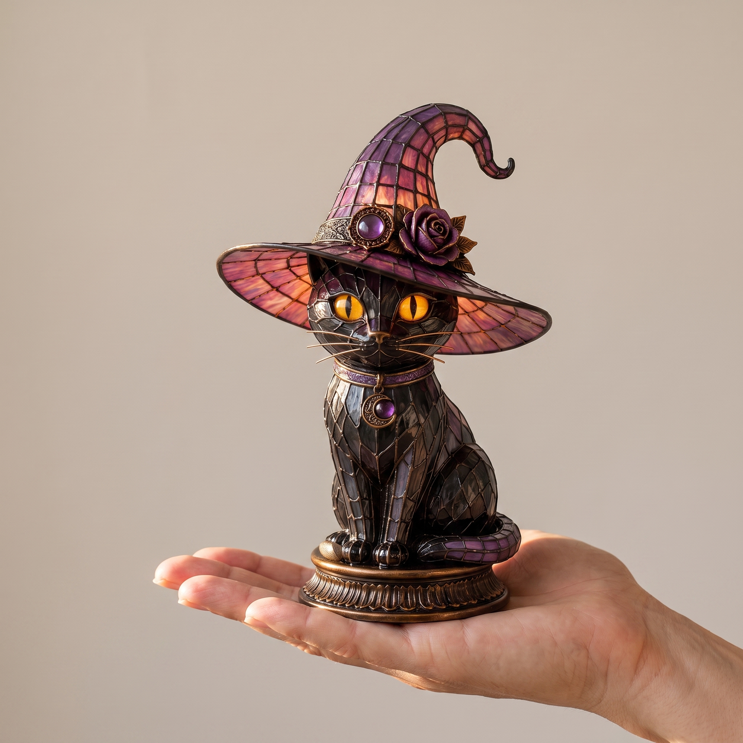 The lamp held on an open hand to show its true size, about six inches tall