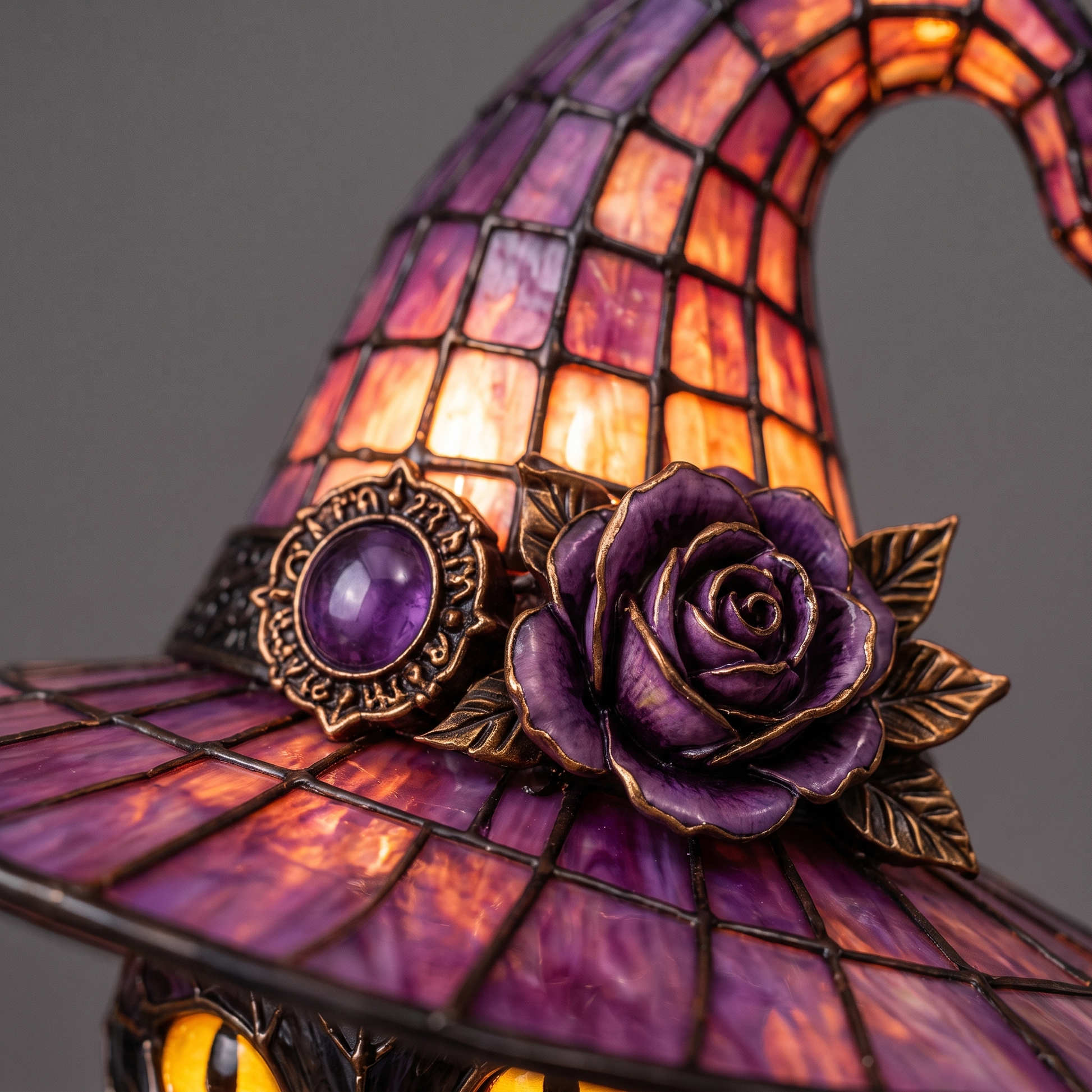 Close-up of the carved rose and amethyst on the witch hat
