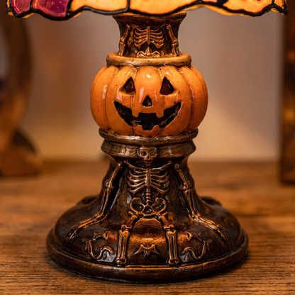 Detail of the solid cast base with figural relief columns and pumpkin centre