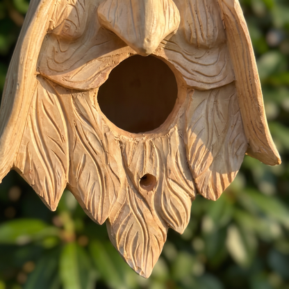 Close-up of the carved leaf beard, entrance and drain hole
