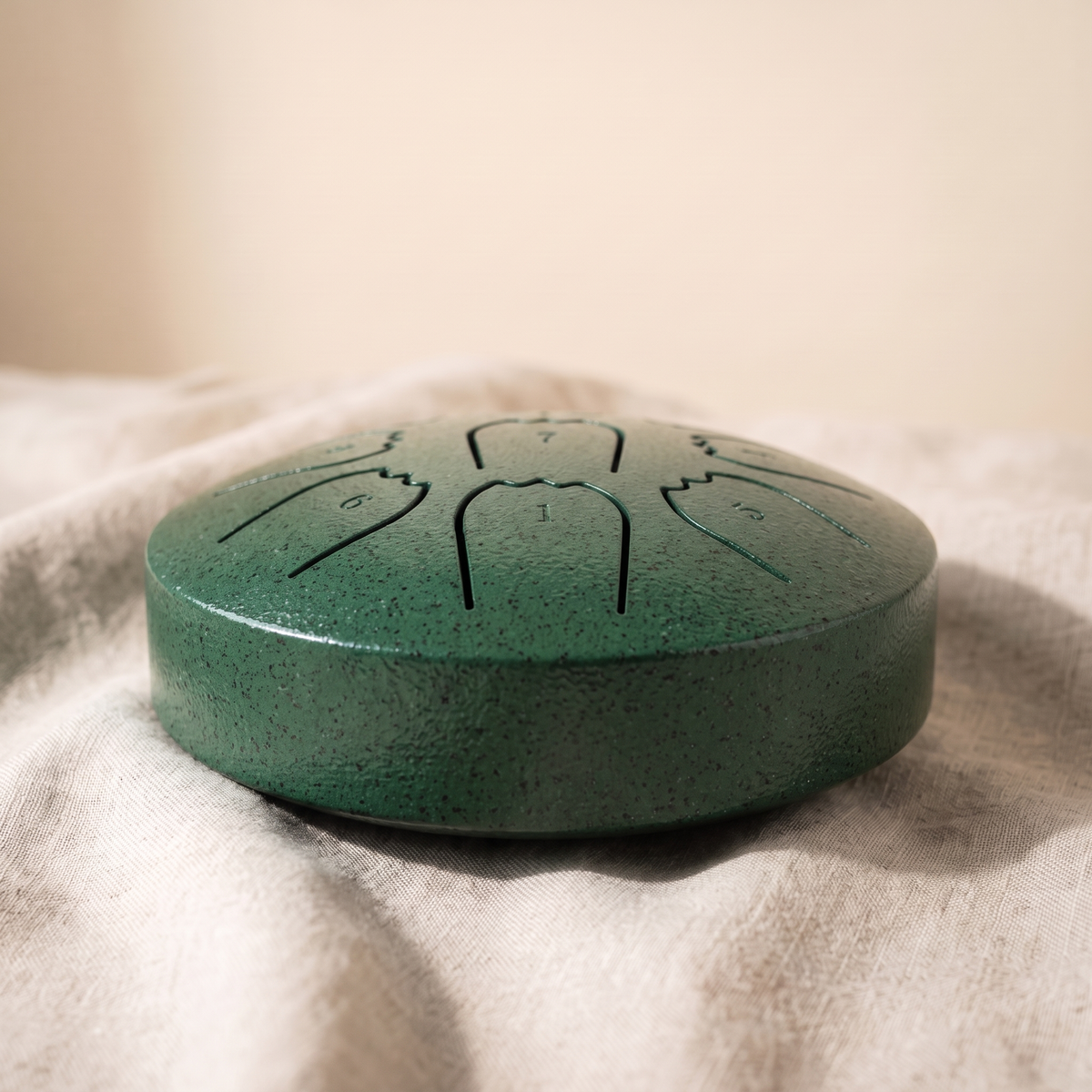 Hand-tuned rain drum in deep forest green