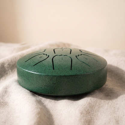 Hand-tuned rain drum in deep forest green