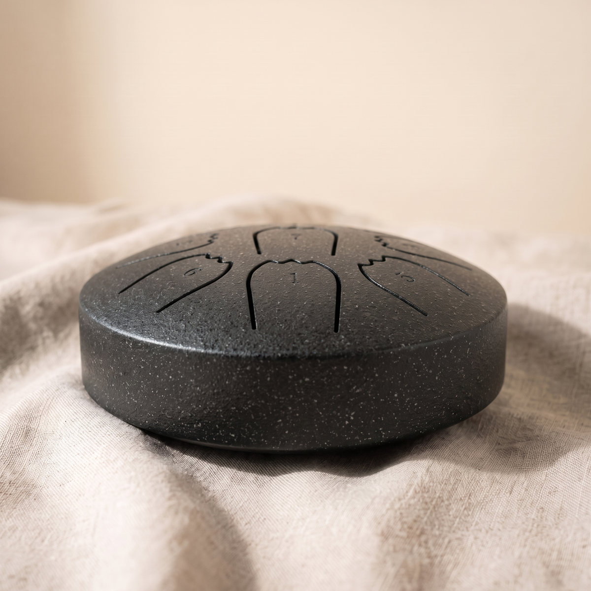 Hand-tuned rain drum in matte charcoal black