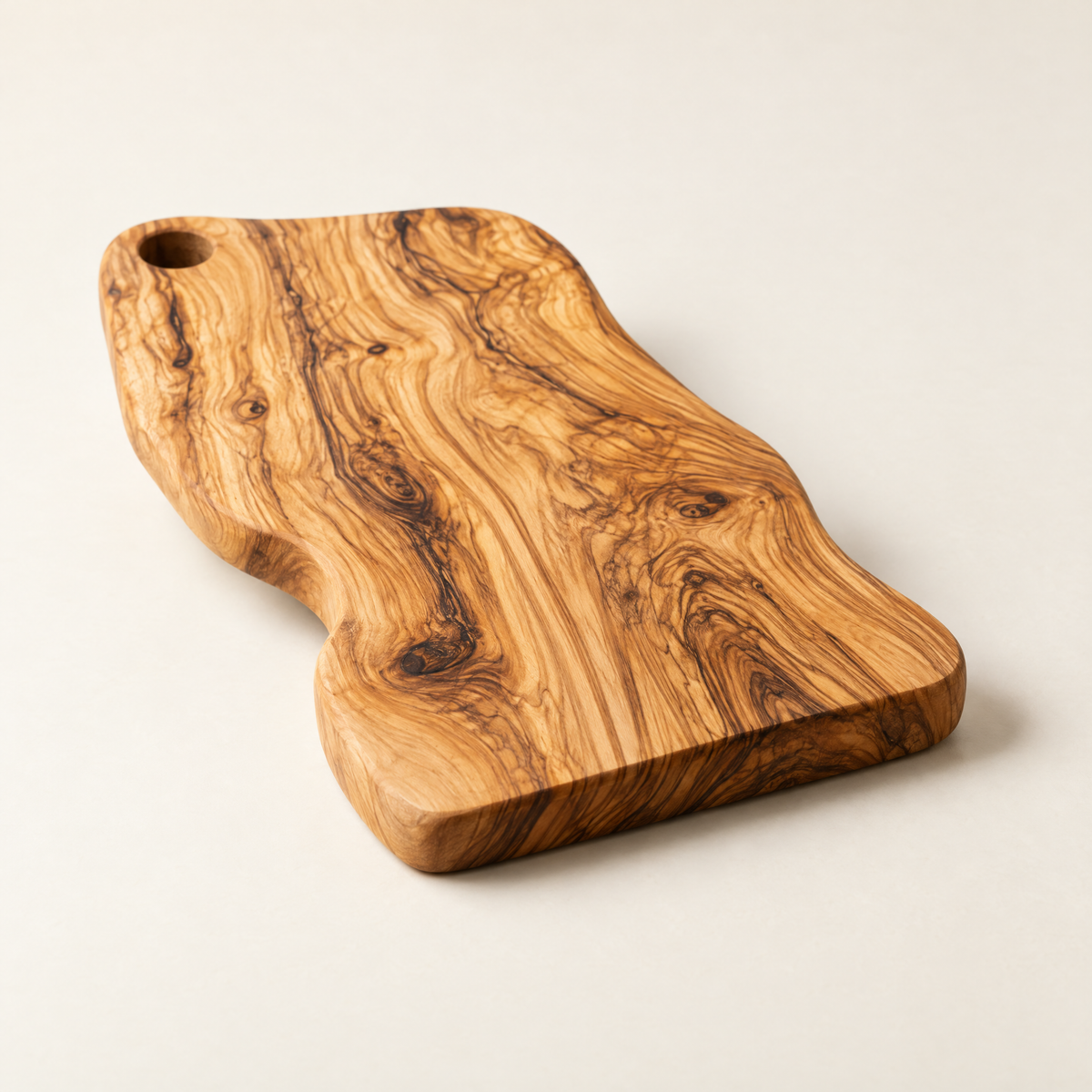 Olive wood cutting board from the side, 1 inch thick