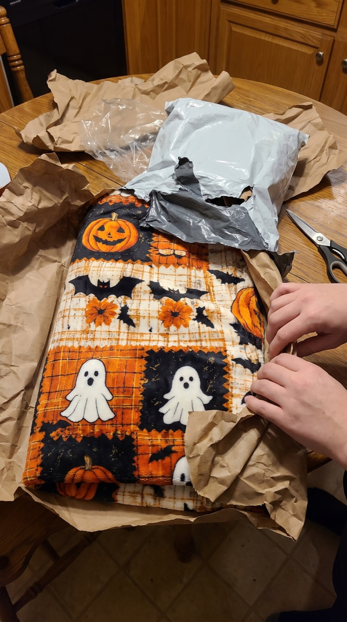 Unwrapping the blanket on a kitchen table