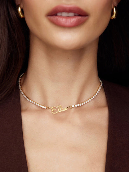 The Celeste pearl name necklace — worn with everyday outfit