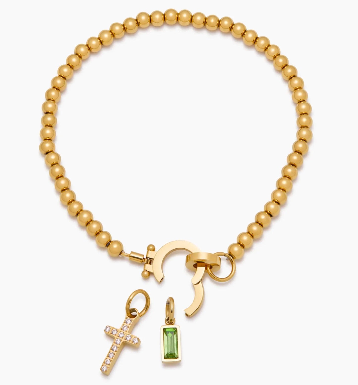 The Faith — pavé cross and birthstone close-up