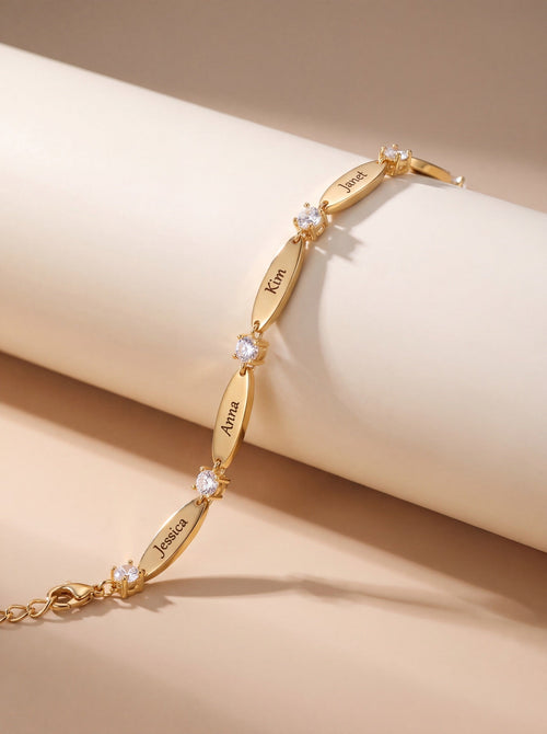 The Luna personalized name bracelet in gold on marble