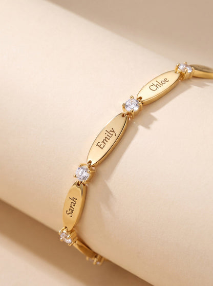 Gold name bracelet with engraved names on silk