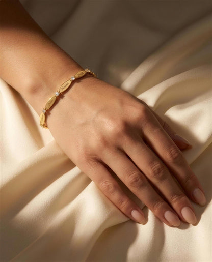 The Luna name bracelet worn on a wrist