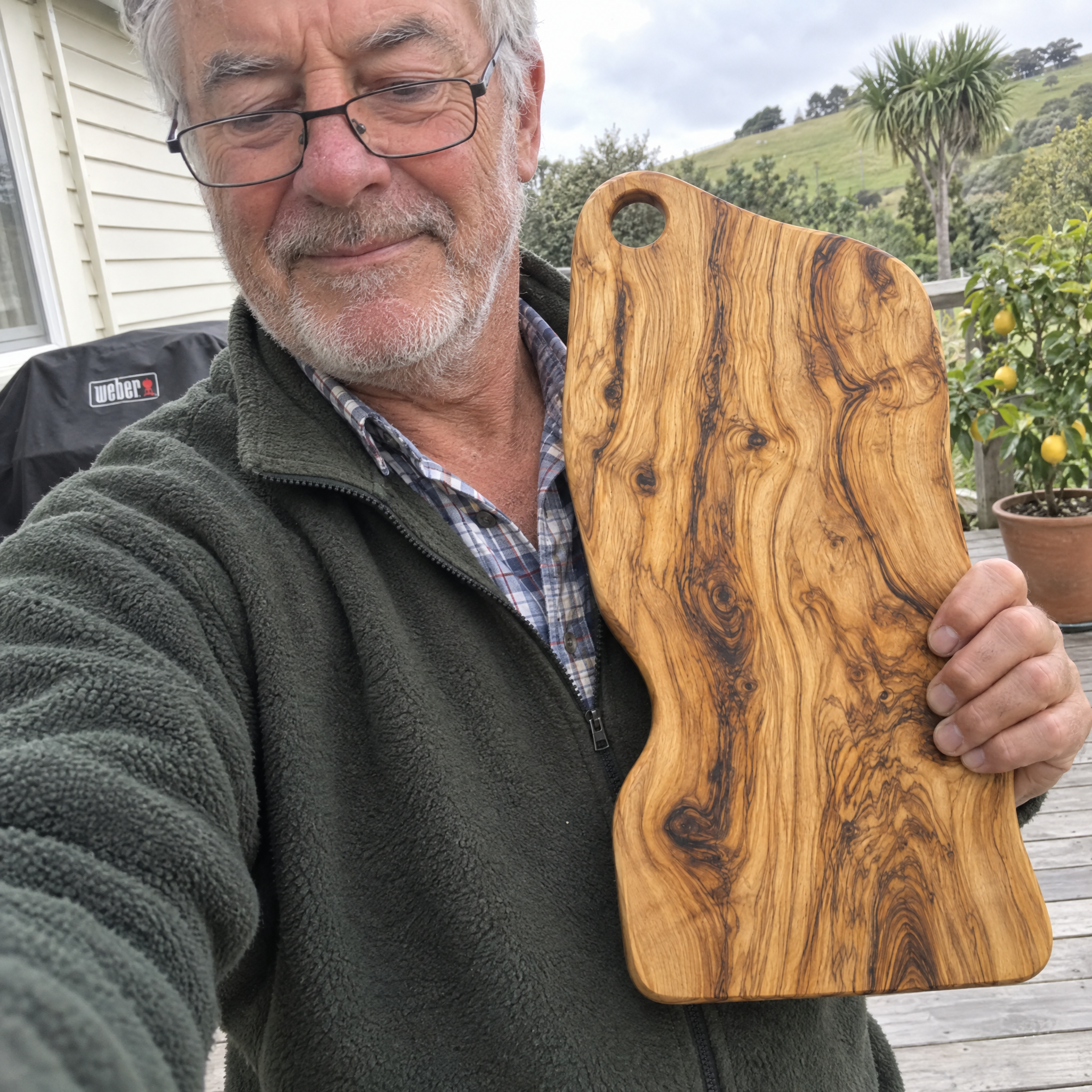 Customer selfie holding the olive wood board