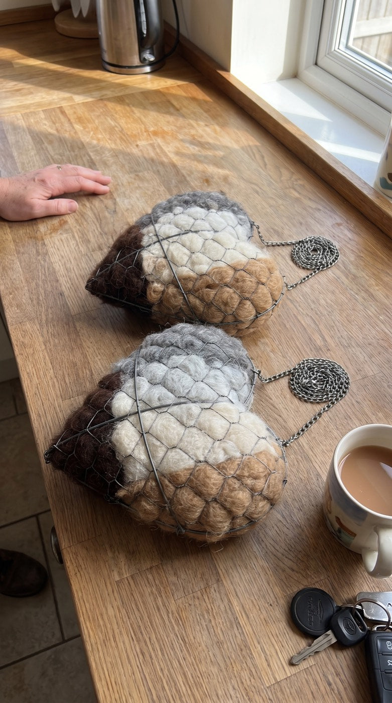 Two nesting hearts on a kitchen worktop beside a mug of tea