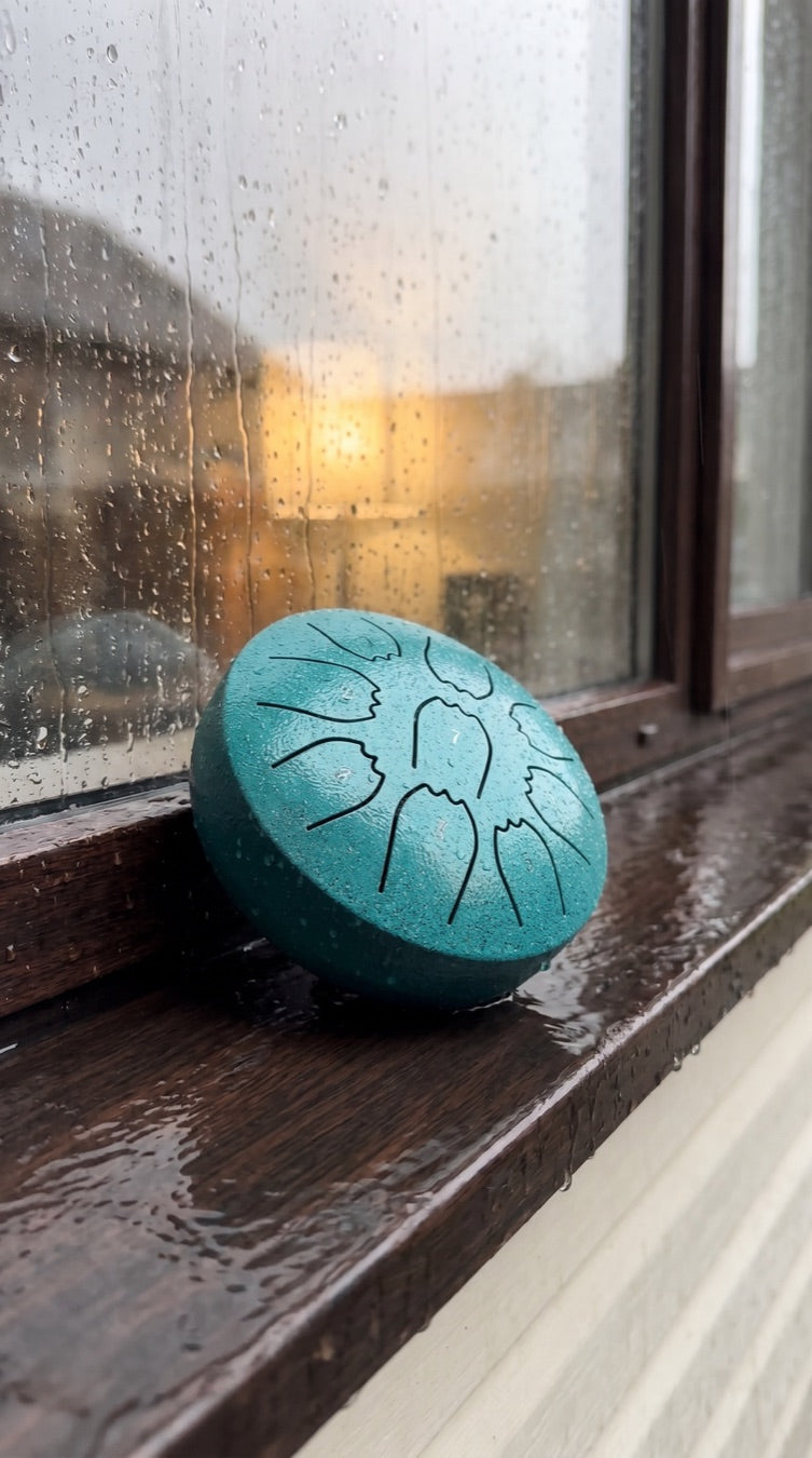 Rain drum on a kitchen windowsill