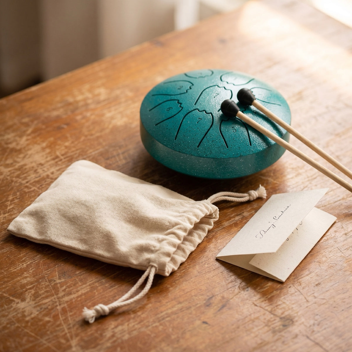 Rain drum with cloth pouch and Margaret's handwritten note