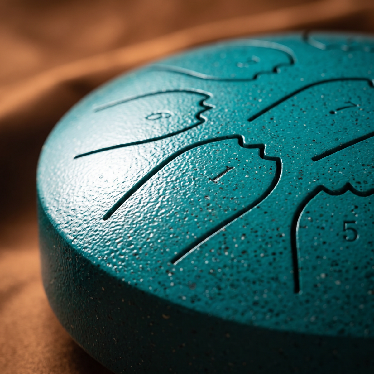 Side close-up of the hand-tuned rain drum, teal pearl finish