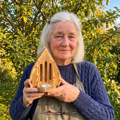 Wendy Scammell holding one of her last butterfly houses
